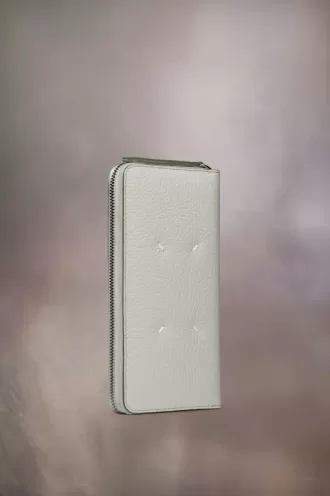 Cartera con cremallera de cuatro puntadas