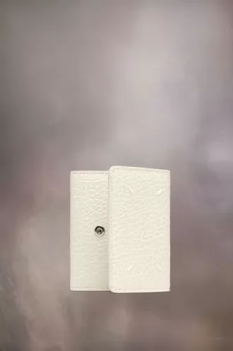 Cartera de cuatro puntadas