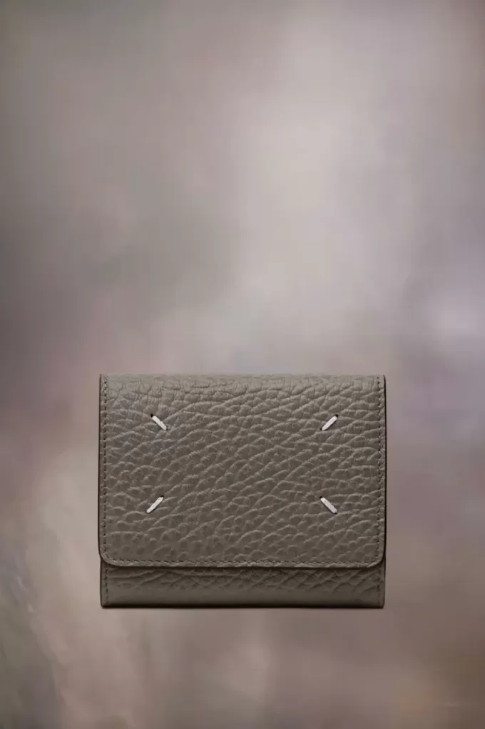 Cartera de cuatro puntadas