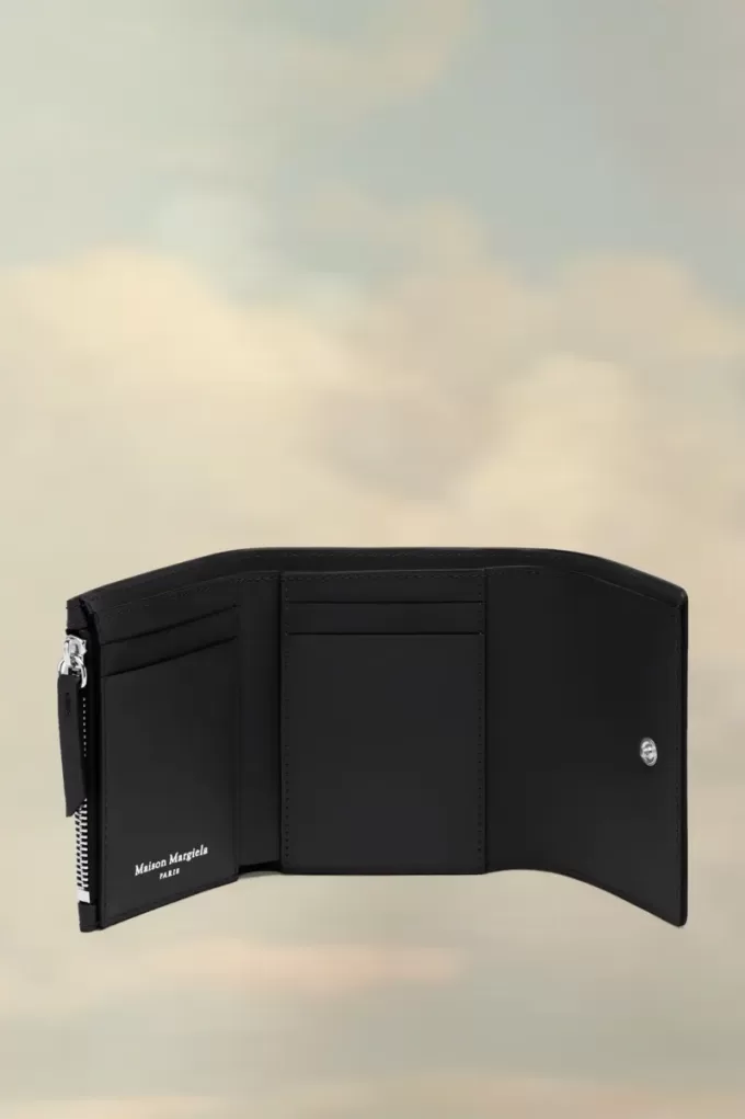 Cartera de cuatro puntadas