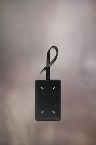 Etiqueta de equipaje de cuatro puntadas