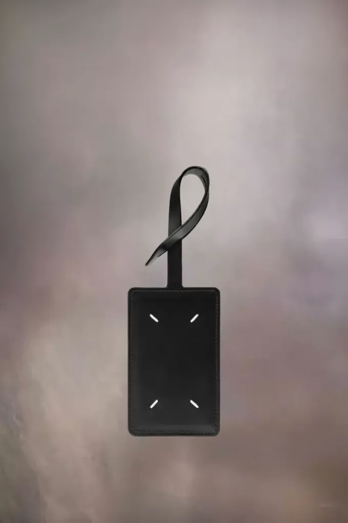 Etiqueta de equipaje de cuatro puntadas