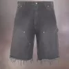 Pantalones cortos vaqueros con tachuelas de Maison Margiela
