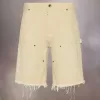Pantalones cortos vaqueros con tachuelas de Maison Margiela