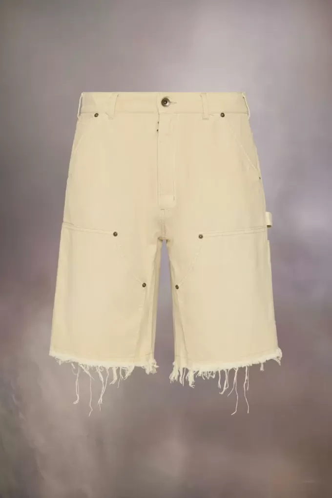 Pantalones cortos vaqueros con tachuelas de Maison Margiela