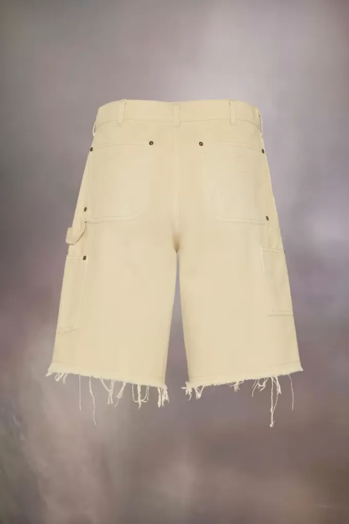 Pantalones cortos vaqueros con tachuelas de Maison Margiela